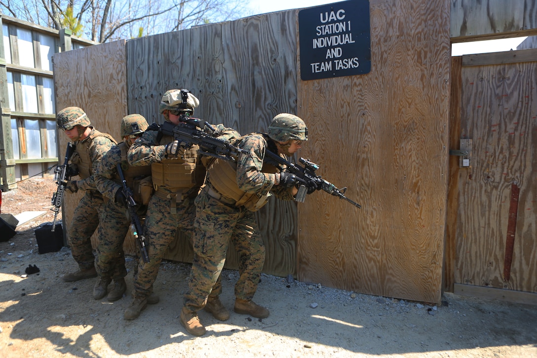 From right to left: Lance Cpl. Alex Albertson, a driver from Atlanta, Lance Cpl. Daniel Di Rico, a gunner from Lighthouse Point, Fla., Cpl. Joshua “Wildebeest” Williams, the team leader from Tampa, Fla., and Lance Cpl. Ashley Wyatt, the team’s dismount from Mebane, N.C., all with Anti-Tank Platoon, 2nd Tank Battalion, 2nd Marine Division, prepare to clear a house during an Urban Assault Course at Ft. Pickett, Va., April 2, 2014. “It is good to know you hit the target and if it were an enemy trying to kill you or your brothers that you can take him out first,” said Cpl. Patrick W. Westcott, a Tiverton, R.I. native and team leader with Scout Platoon.