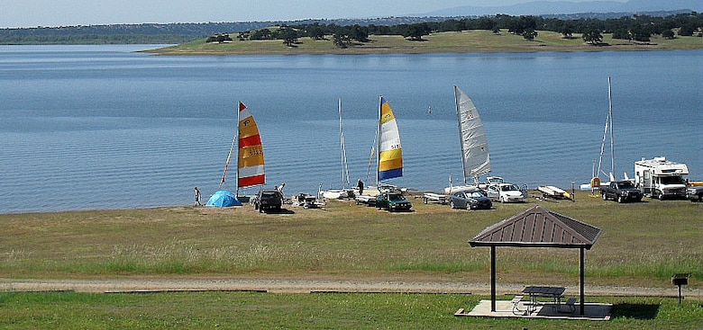Sailors take a break on the shore of Black Butte Lake during a regatta on the weekend of May 10, 2014. 