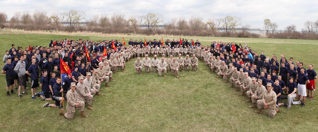 Marines and future Marine Corps recruits with Marine Corps Recruiting Station Detroit pose for a group photo after participating in the station's all-hands pool function May 3, 2014. The pool function was designed to allow the future recruits to build camaraderie and prepare to leave for recruit training at Marine Corps Recruit Depot Parris Island, S.C. After competing in multiple events, Recruiting Sub-Station Mount Clemens came out on top and took home the trophy. (U.S. Marine Corps photo by Sgt. Elyssa Quesada/Released)