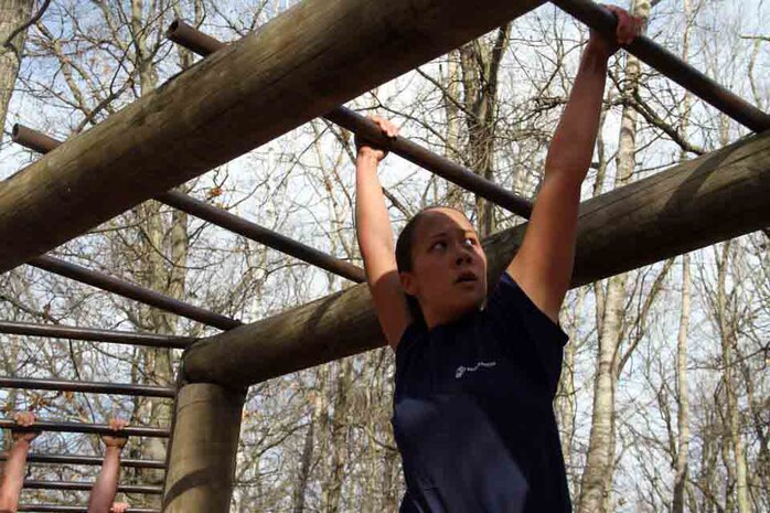 Poolee Maureen Abayare navigates her way through one of the obstacles at the obstacle course aboard the 2014 RS Twin Cities Mini-Bootcamp. Other obstacles included jumping over logs and climbing a rope tower. 