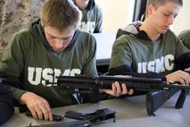 Officer Candidates School candidates assemble M16A2 service rifles as part of the RS Twin Cities 2014 Mini-Bootcamp. The OCS candidates and poolees from Minnesota, Wisconsin and the Dakotas learned the operational and safety features of the weapon as part of their training. 