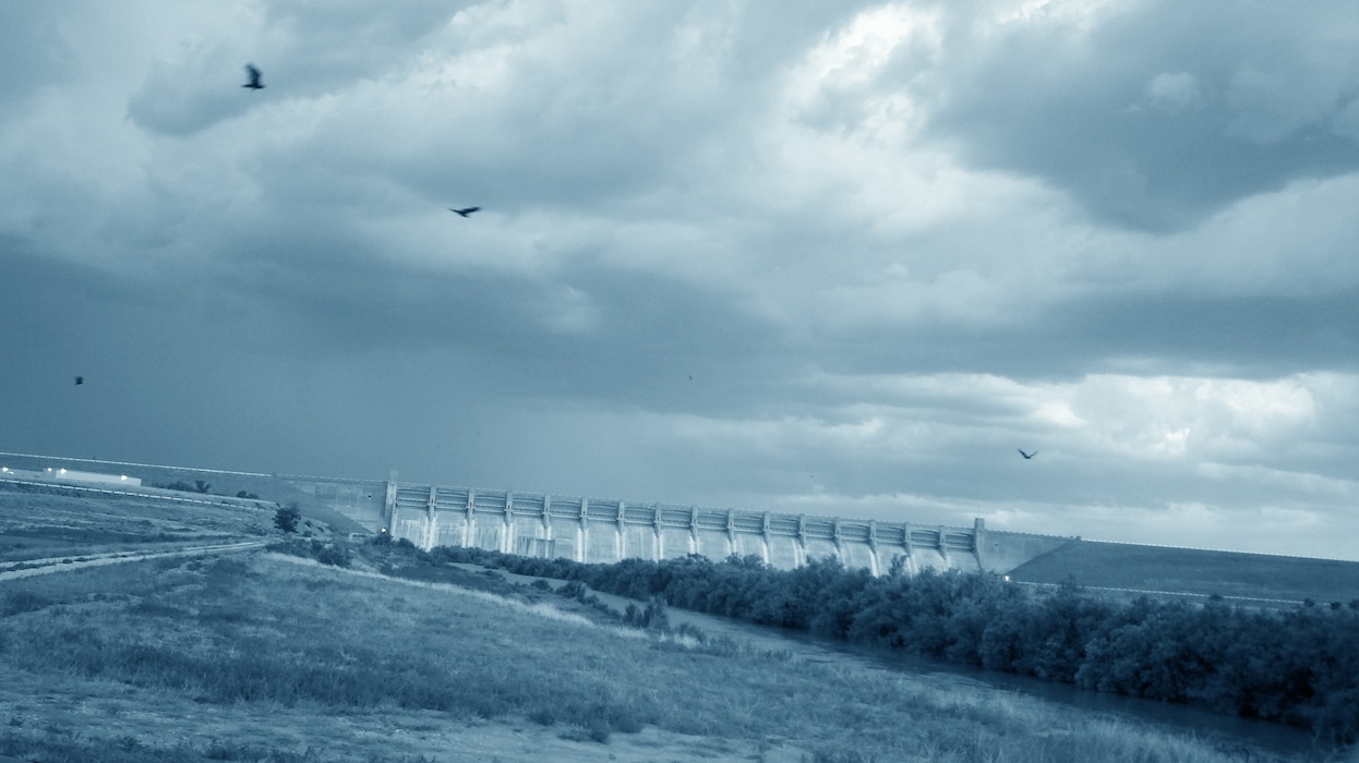 JOHN MARTIN RESERVOIR & DAM, Colo., -- A thunder storm approaches the dam.  The photo was taken downstream of the stilling basin by Carlos Aragon, July 21, 2011.
