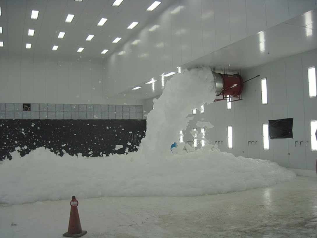 HOLLOMAN AIR FORCE BASE, N.M., -- As part of commissioning, the Hi-Ex foam fire suppression system at Alter Hangar 898 was tested.  Up to a meter of foam covered the floor in approximately one minute. Photo by Daniel Garcia, Aug. 24, 2011.