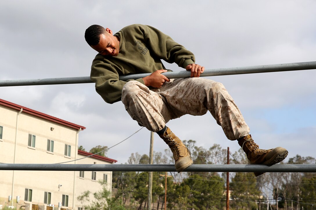 Cpl. Oalandre Ricks, an aircraft maintenance administration specialist with Marine Heavy Helicopter Squadron 462, climbs over an obstacle during a Corporal’s Indoctrination course aboard Marine Corps Base Camp Pendleton, Calif., May 8. The three-day course was held to teach newly promoted Marines what is expected of them as newly promoted noncommissioned officers in the Marine Corps.
