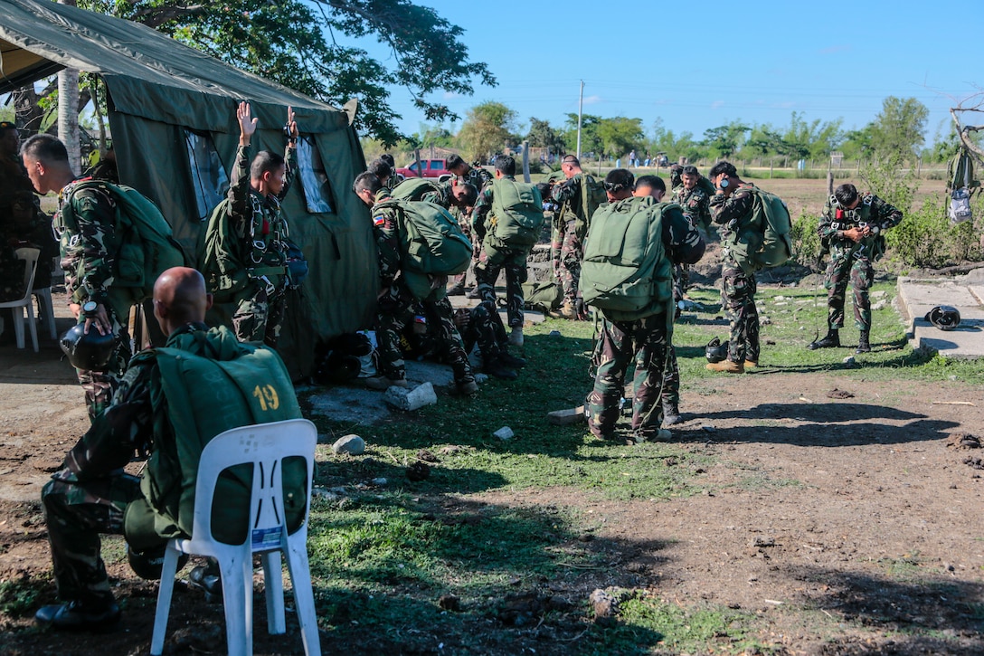 Philippine Airborne Special Forces prepare to execute an Airborne exercise during Balikatan 2014 on Fort Magsaysay, Philippines, May 6, 2014. The service members conduct preventative checks maintenance and services on all parachute equipment before executing a High Altitude, Low Opening jump from an MV-22 Osprey. This year marks the 30th iteration of the exercise, which is an annual Republic of the Philippines-U.S. military bilateral training exercise and humanitarian civic assistance engagement.
