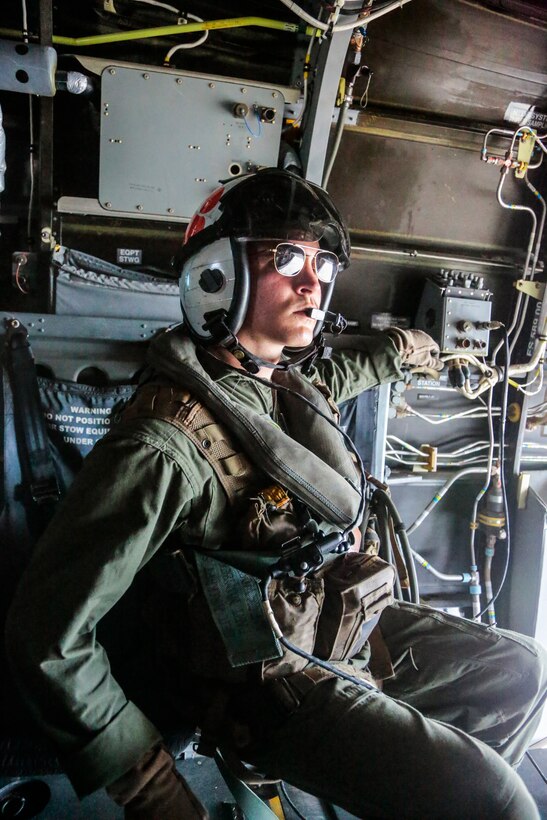 U.S. Marine Cpl. Jacob Pratt of Marine Medium Tiltrotor Squadron 262 (VMM-262), assists with an Airborne exercise during Balikatan 2014 on Fort Magsaysay, Philippines, May 6, 2014. Pratt is a member a V-22 Osprey flight crew that is transporting both Philippine and U.S. service members 10,000 ft in the air to execute a High Altitude, Low Opening airborne jump. This year marks the 30th iteration of the exercise, which is an annual Republic of the Philippines-U.S. military bilateral training exercise and humanitarian civic assistance engagement.