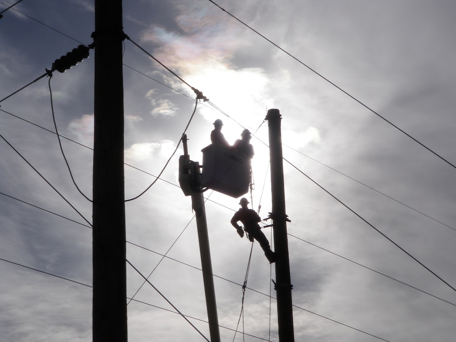 ALBUQUERQUE, N.M., -- Electrical subcontractors work on a power pole relocation as part of the District’s Southwest Valley Flood Damage Reduction Project. Photo by Jacob Chavez, Jan. 25, 2011.