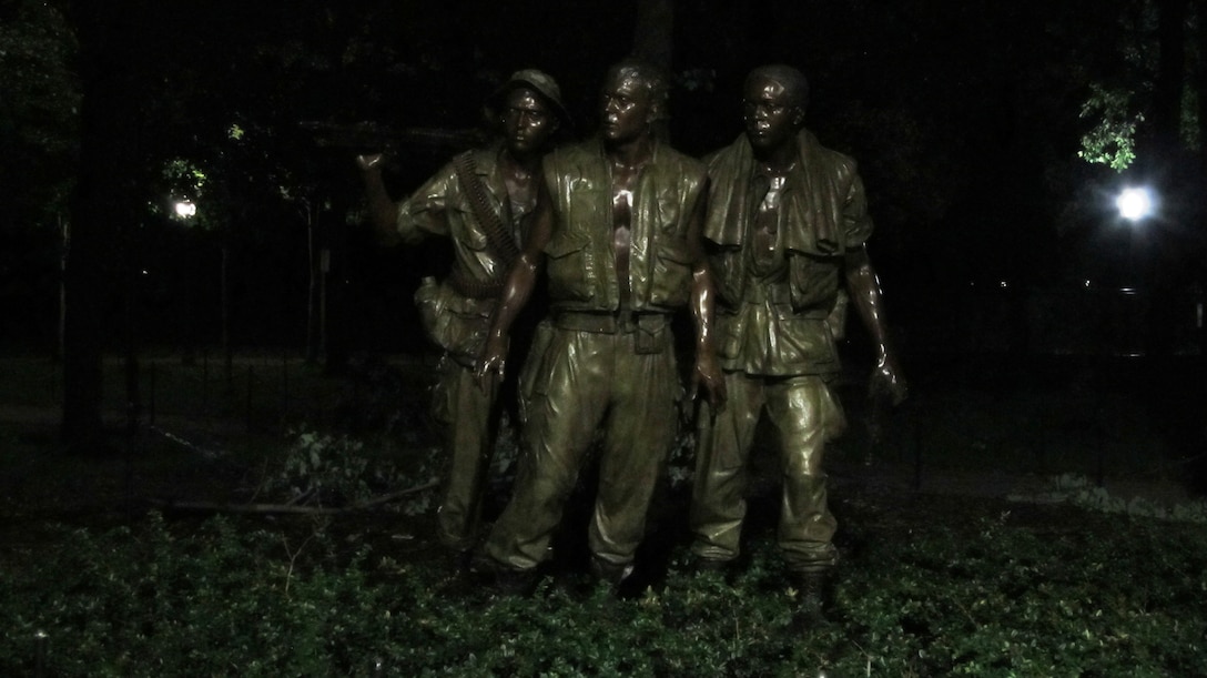 WASHINGTON, D.C., -- This photo of a statue of Vietnam Veterans was taken around midnight after Hurricane Irene had blown through the nation’s capital, Aug. 28, 2011. Maj. Phil Bundy was in Washington, D.C. supporting the Corps’ disaster relief efforts.  