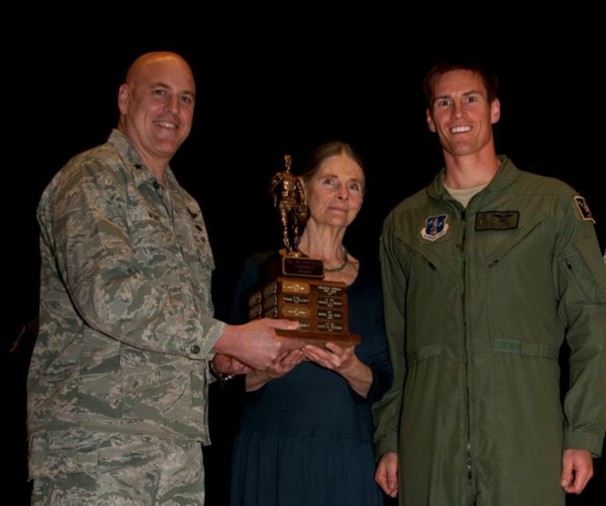 JOINT BASE ELMENDORF-RICHARDSON, Alaska – Mrs. Joan Lindemuth and 176 Wing commander, Brig. Gen. Donald Wenke present the Paul W. Lindemuth Leadership Award here May 3, 2014, to Maj. Matthew Kirby from the 212 Rescue Squadron. The award is given in memory of former wing commander, Brig. Gen. Lindemuth, and is presented to the 176 Wing senior officer who best epitomizes leadership and dedication to the nation, state and Alaska Air National Guard. U.S. Air National Guard photo by Tech. Sgt. Jennifer Theulen/ Released.