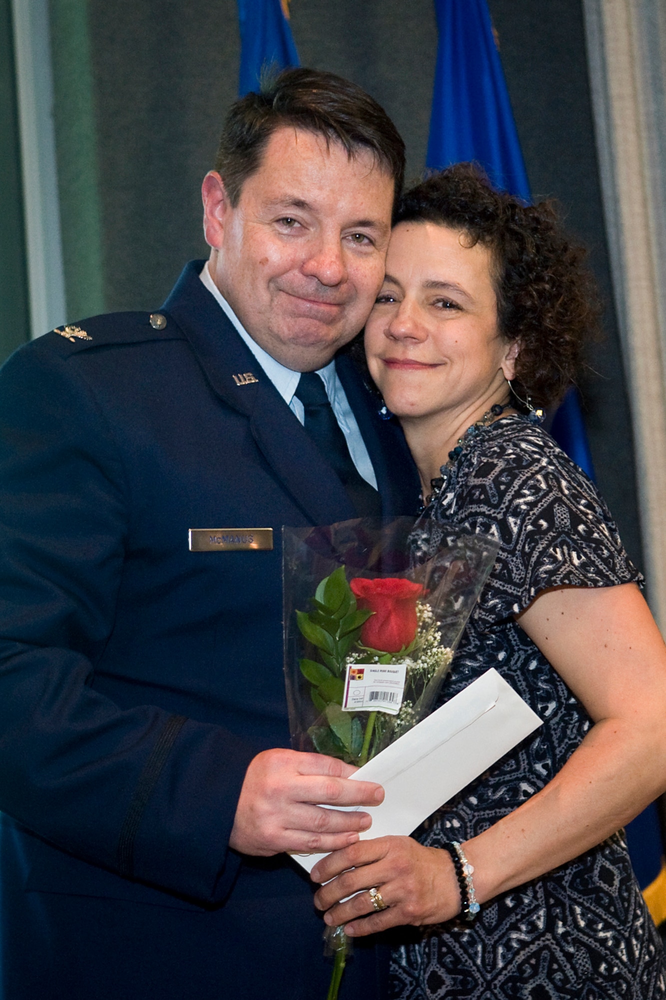 Newly promoted Col. Stephen McManus, 434th Air Refueling Wing staff judge advocate, poses for a photo with his wife, Moira, shortly after having his eagle rank insignia pinned on during a special ceremony at Grissom Air Reserve Base, Ind., April 12, 2014. The history of the prestigious rank dates back to around 1505, when the Spanish King Ferdinand reorganized part of his army into twenty units called colunelas. (U.S. Air Force photo/Tech. Sgt. Mark R. W. Orders-Woempner)
