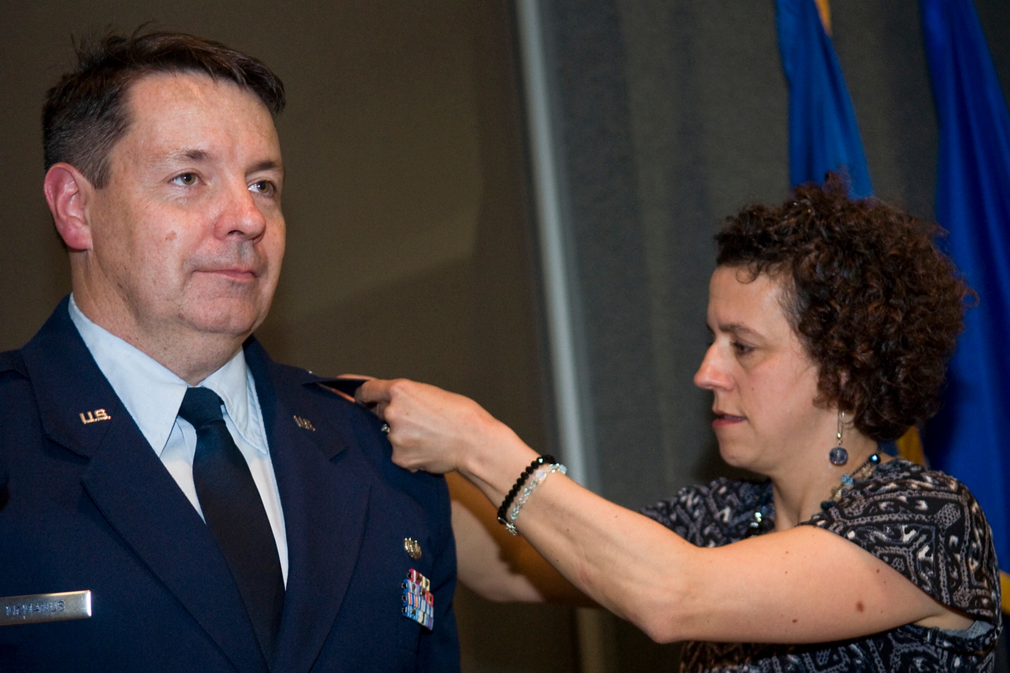 Moira McManus, wife of newly promoted Col. Stephen McManus, 434th Air Refueling Wing staff judge advocate, pins eagle rank insignia on her husband during a special ceremony at Grissom Air Reserve Base, Ind., April 12, 2014. The history of the prestigious rank dates back to around 1505, when the Spanish King Ferdinand reorganized part of his army into twenty units called colunelas. (U.S. Air Force photo/Tech. Sgt. Mark R. W. Orders-Woempner)
