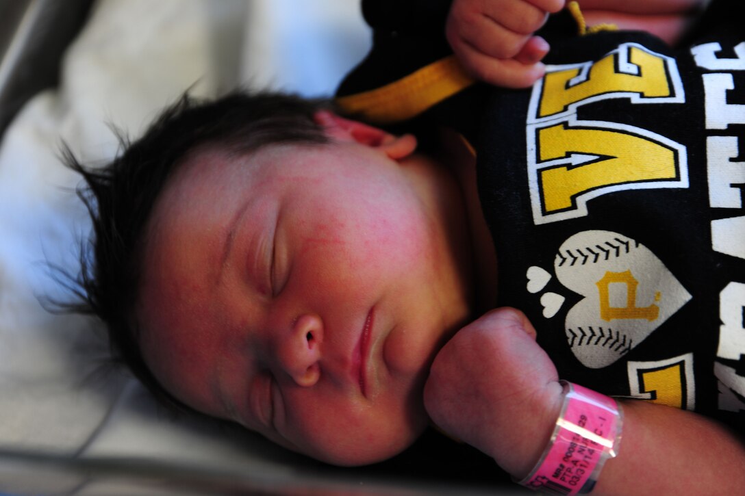 Kynnedie, newborn daughter to Kaila and Airman 1st Class Samuel DeWitt, takes a nap at MedStar Southern Maryland Hospital on her birthday, March 31,2014. DeWitt, 79th Medical Staging Squadron diet therapy apprentice, and his wife, said Kynnedie’s grandmother, Ginger Preston, is their hero. (U.S. Air Force photo / Amber J. Russell)