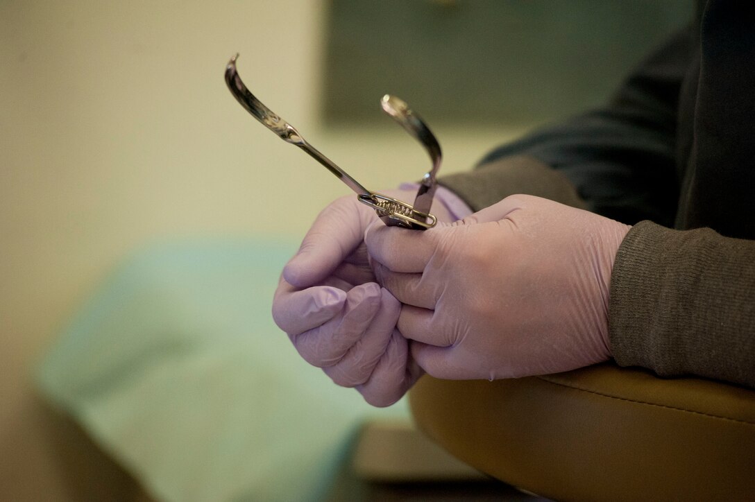 Capt. Brandon Keyser, 82nd Dental Squadron general dentist, performs a root canal May 5, 2014. The 82nd DS mission is to ensure adequate dental care is given across the entire base. (U.S. Air Force photo by Airman 1st Class Jelani Gibson) 