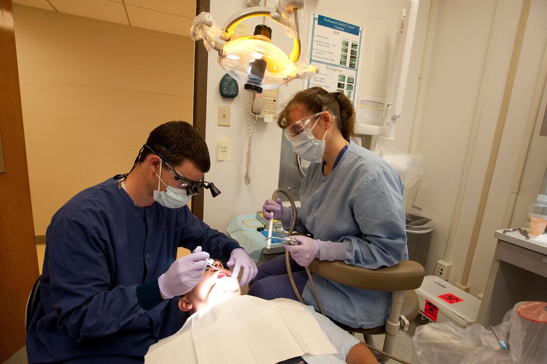 Capt. Brandon Keyser, 82nd Dental Squadron general dentist, performs a root canal May 5, 2014. The 82nd DS mission is to ensure adequate dental care is given across the entire base. (U.S. Air Force photo by Airman 1st Class Jelani Gibson) 