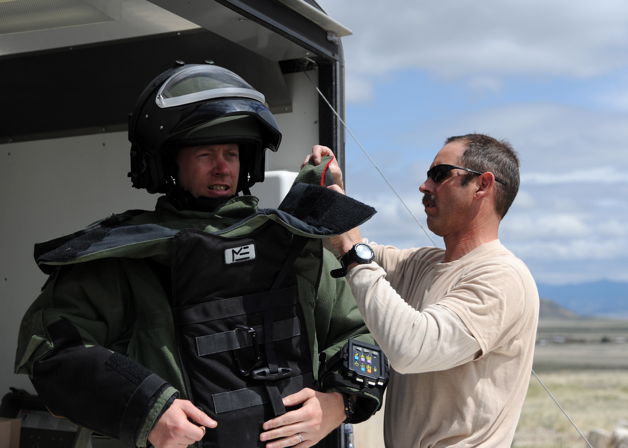 Tech. Sgt. Scott Lawson, 120th Airlift Wing Explosive Ordnance Disposal technician, gets dressed in the Explosive Ordinance Disposal-9 bomb suit. The EOD teams perform their training at Ft. Harrison in Helena, Mont., because it opens up more options for them to practice and utilize their supplies. (U.S. Air Force photo/ Airman 1st Class Joshua Smoot)