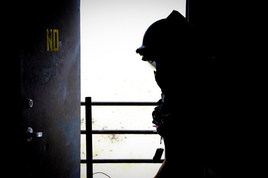 Capt. Daniel Blomberg, 341st Civil Engineer Squadron Explosive Ordnance Disposal flight commander, prepares to search a room for a suspected improvised explosive device. Some examples of IEDs include jugs loaded with five pounds of unknown bulk explosives or a pipe bomb. (U.S. Air Force photo/ Airman 1st Class Joshua Smoot)