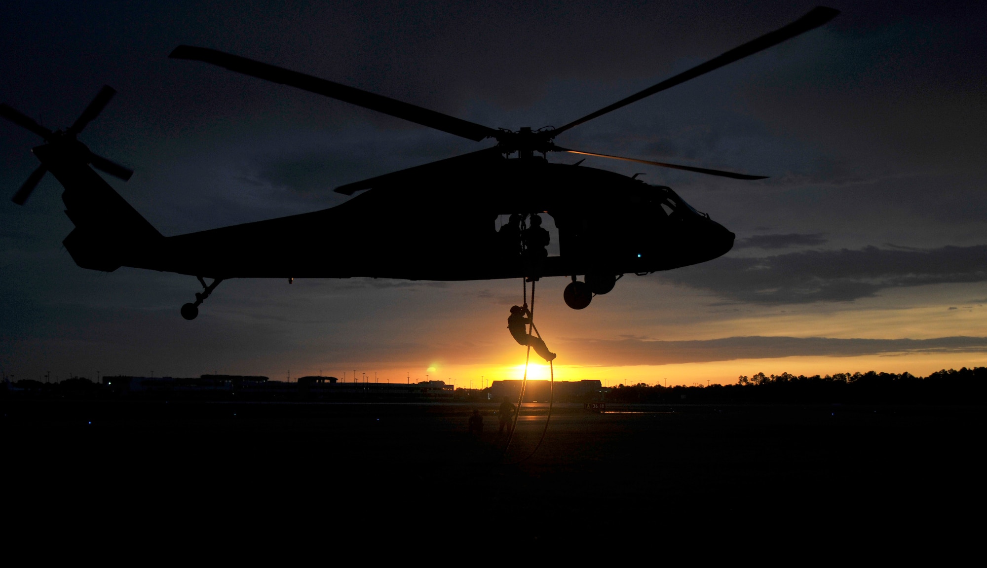 Miss. Army National Guard Soldiers with the 1st Battalion, 185th Aviation Regiment and 2nd Battalion, 20th Special Forces Group (Airborne) conduct fast rope insertion training as part of Operation Emerald Warrior, a multinational, joint force training exercise April 30, at the Combat Readiness Training Center. The training ensures the units are trained and ready for any state emergency or combat mission. (U.S. Army National Guard photo by Staff Sgt. Shane Hamann, 102nd Mobile Public Affairs Detachment)