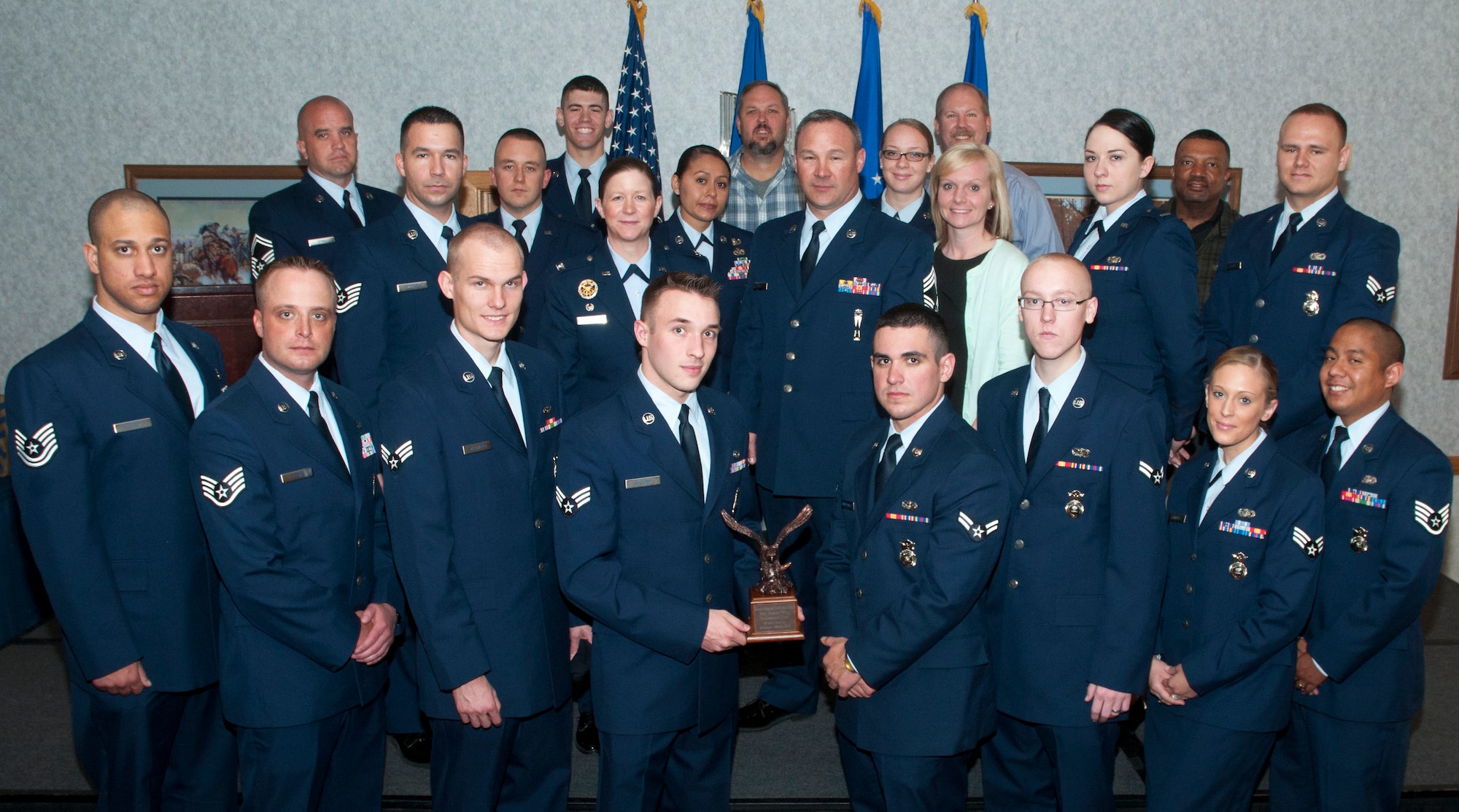 The 90th Missile Wing First Quarter Award winners pose for a group photo in the Trail's End Club May 9, during an award ceremony. (U.S. Air Force photo by Airman Malcolm Mayfield)