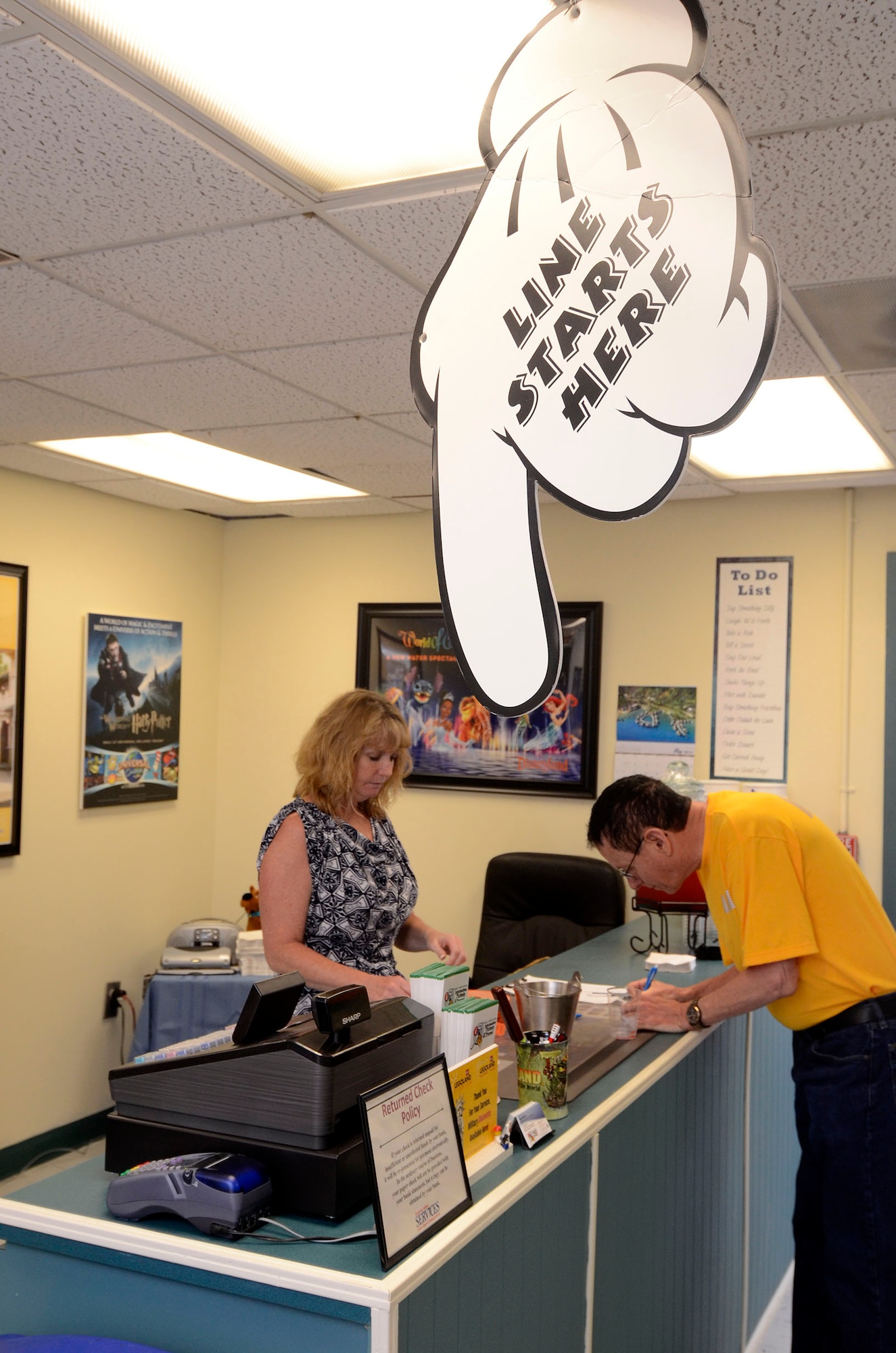 A ribbon cutting ceremony marks the opening of the new location of the Information, Tickets and Travel office on Dobbins Air Reserve Base, Ga. May 9. The new larger office is collocated with recreation services creating a one-stop shopping experience for customers. (U.S. Air Force photo/Don Peek)