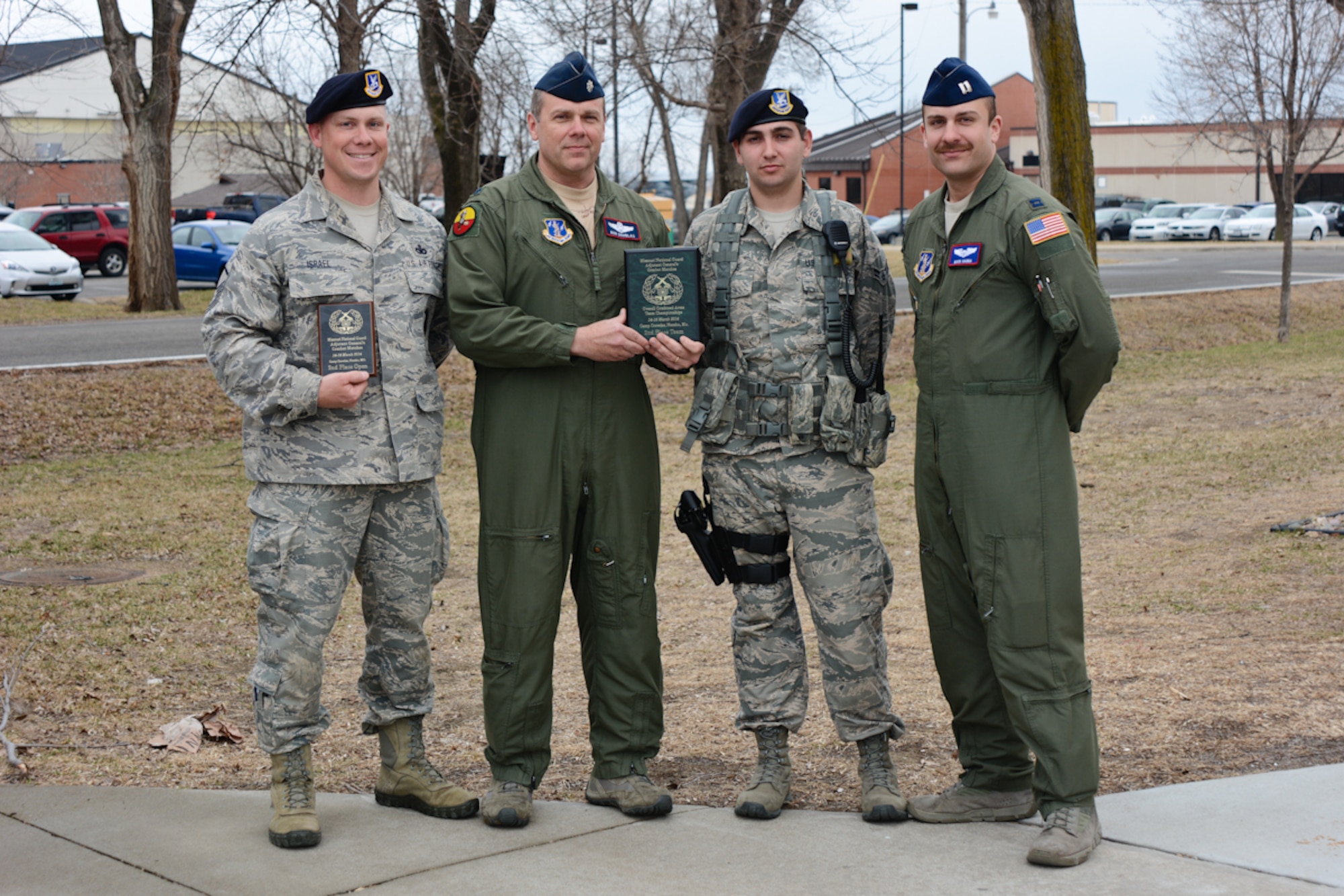 (From left) Master Sgt. Ben Israel, 139th Security Forces Squadron, Lt. Col. Ron Douglas, 180th Airlift Squadron, Airman 1st Class Williams, 139th Security Forces Squadron, and Capt. Mark Hanna, 180th Airlift Squadron pose for a photo at Rosecrans Air National Guard Base, Mo., March 27, 2014. This was one of three teams from the 139th Airlift Wing that competed in the Missouri National Guard Adjutant General’s Combat Tournament. (U.S. Air National Guard photo by Tech. Sgt. Michael Crane/Released)