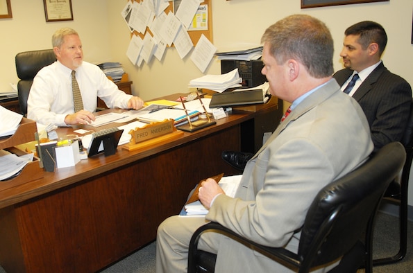 Fred Anderson, Small Business specialists, discusses the business opportunities with his customers, Jerry Tritle (left) and Dave Garcia, from Peerless Technologies, May 7, 2014. (U.S. Air Force photo by Misuzu Allen)