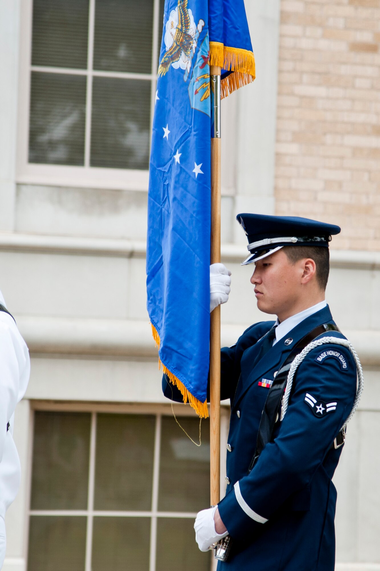 SAN ANGELO, Texas-- Airman 1st Class Aziz N. Sarbashev, 17th Force Support Squadron personnel technician, marches with the Air Force flag during the National Day of Prayer event at the Tom Green County Courthouse here April 29. Sarbashev has been a member of the honor guard since 2013 and earned the 17th Training Wing Honor Guard member of the year award for 2013. (U.S. Air Force photo/ Senior Airman Michael Smith)