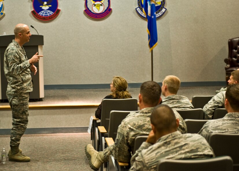 U.S. Air Force Col. Michael Bob Starr, 7th Bomb Wing commander, invites participants to ask questions of Dr. David Itkin, Abilene Philharmonic Orchestra conductor, during a leadership and innovation forum held May 5, 2014, at Dyess Air Force Base, Texas.  The purpose of the forum was to expose Airmen to different methods or thoughts about leading. During his speech, Itkin said it is important for leaders to encourage subordinates to ask questions, foster an atmosphere that encourages creativity and to allow subordinates to take the lead when appropriate. He added, when creative and innovative ideas are presented, they should be acknowledged in a positive way, even if in the end, the idea isn’t going to be used. (U.S. Air Force photo by Airman 1st Class Autumn Velez/Released)