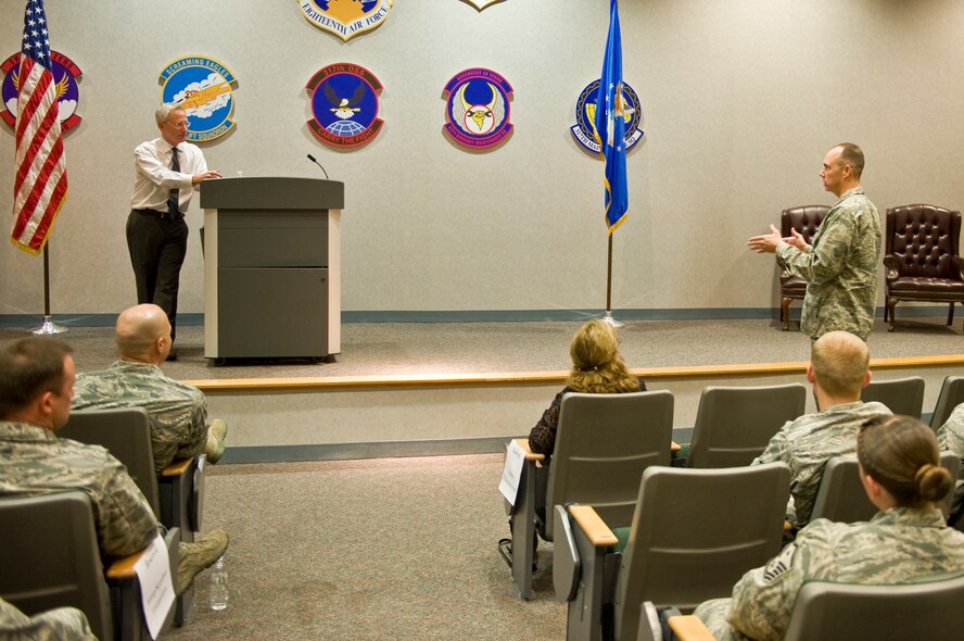 U.S. Air Force Col. Richard Gibbs, 7th Maintenance Group commander, asks Dr. David Itkin, Abilene Philharmonic Orchestra conductor, a question during a leadership and innovation forum held May 5, 2014, at Dyess Air Force Base, Texas. Itkin was the guest speaker for event. During his presentation, Itkin noted the hierarchy structure of an orchestra is similar to that of the military’s rank structure. Itkin explained how the structure of an orchestra and the distribution of authority are important, allowing the organization to operate smoothly by establishing responsibility. (U.S. Air Force photo by Airman 1st Class Autumn Velez/Released)