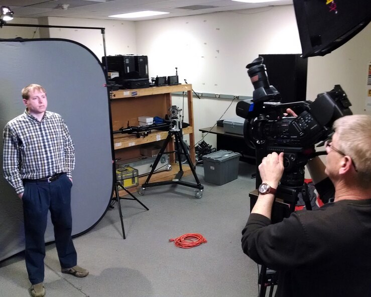 Videographers Matthew Clouse (left) and Jim Mitchell perform camera and lighting tests prior to an assignment. Their work on an Air Force Life Cycle Management Center video that outlines the center’s history, evolution and mission resulted in a first place award in the Department of Defense Visual Information Production Awards documentary category. (Air Force photo by Brian Duke)