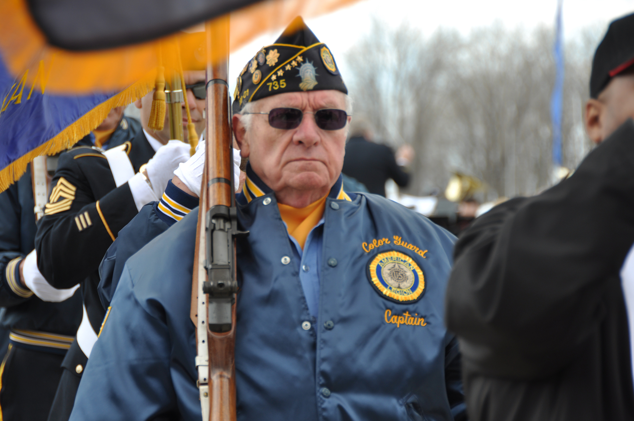 A veteran marches in the joint color guard during 54th Annual Western New York Armed Forces Week opening day ceremony commences, May 4, 2014. The ceremony was held at the Buffalo and Erie County Naval and Military Park and marks the start of a week of recognition, saluting veterans past and present. (U.S. Air Force photo by Staff Sgt. Stephanie Clark) 