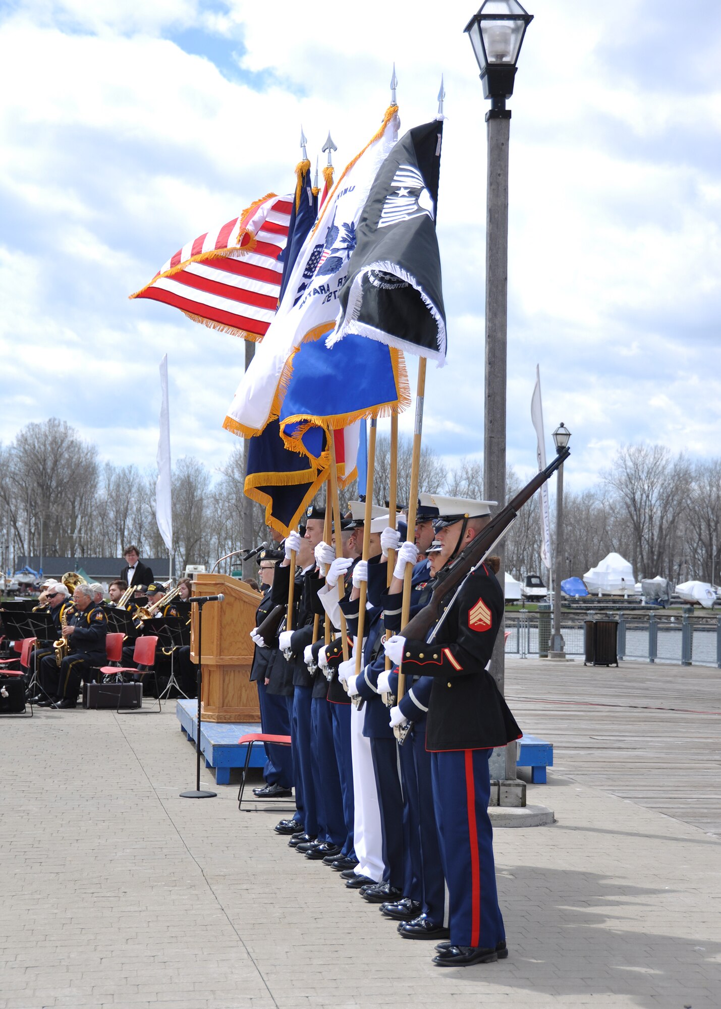 Members of the Joint Color Guard stand at attention as the 54th Annual Western New York Armed Forces Week opening day ceremony commences, May 4, 2014. The ceremony was held at the Buffalo and Erie County Naval and Military Park and marks the start of a week of recognition, saluting veterans past and present. (U.S. Air Force photo by Staff Sgt. Stephanie Clark) 