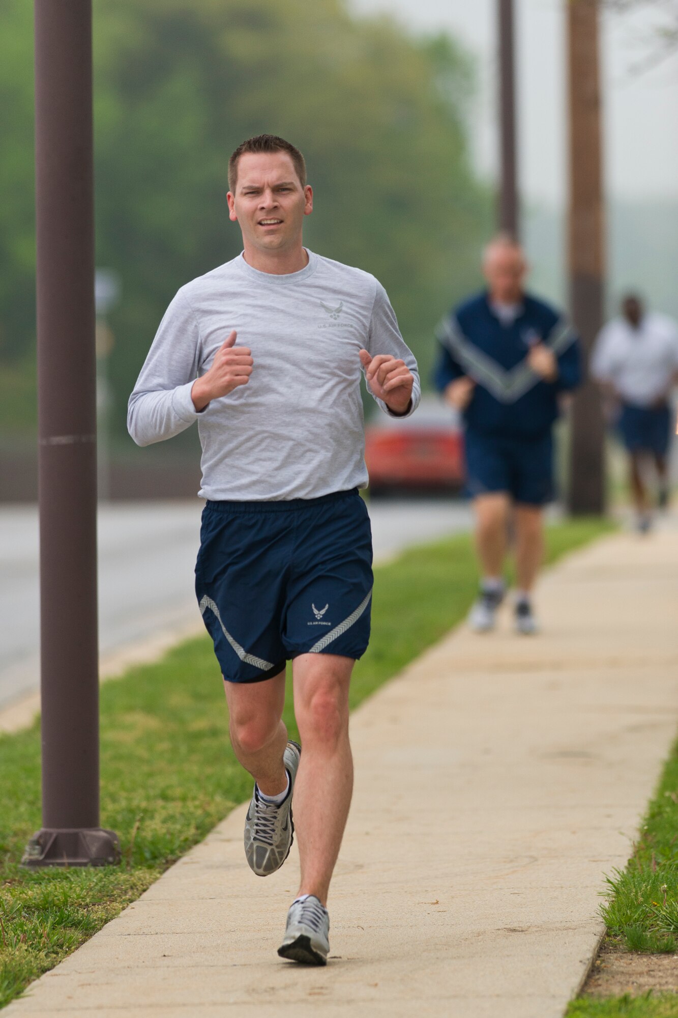 Air Guardsmen from the Air National Guard Readiness Center, Joint Base Andrews, Md., participate in a 2-mile fun run before an Enlisted Call May 9, 2014. The theme of the Enlisted Call; "Renewing or Committment to the Profession of Arms", . (U.S. Air National Guard photo by Master Sgt. Marvin R. Preston/Released)