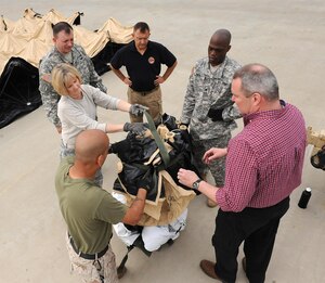 Members of Joint Task Force Civil Support set up Deployable Rapid Assembly Shelters during an Early Entry Command Post deployment exercise at Fort Eustis, Va., May 8, 2014. DRASH is a portable shelter that can be set up within minutes of arriving on-site with no special tools. JTF-CS is preparing for Sudden Response 2014, which will test the unit's movement of equipment and personnel during the initial phases of a simulated man-made or natural disaster. JTF-CS anticipates, plans and prepares for chemical, biological, radiological and nuclear defense support to civil authorities response operations. (Official DOD photo by U.S. Navy Petty Officer 1st Class Brian Dietrick)