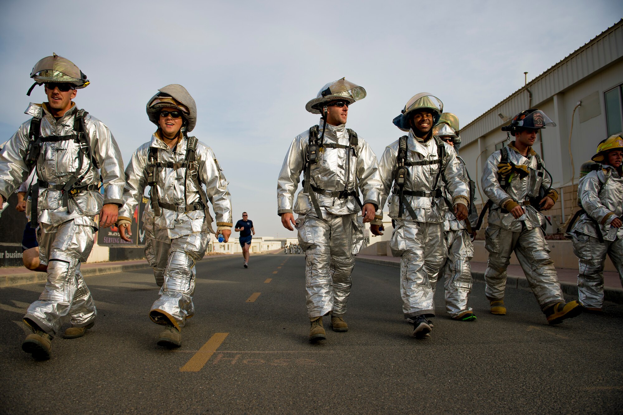 Military members of the 386th Air Expeditionary Wing show their support during a National Explosive Ordnance Disposal Day 5K run May 3, 2014 at an undisclosed location in Southwest Asia. The run memorialized EOD members from the different services who have paid the ultimate sacrifice in the defense of America. (U.S. Air Force photo by Staff Sgt. Jeremy Bowcock)