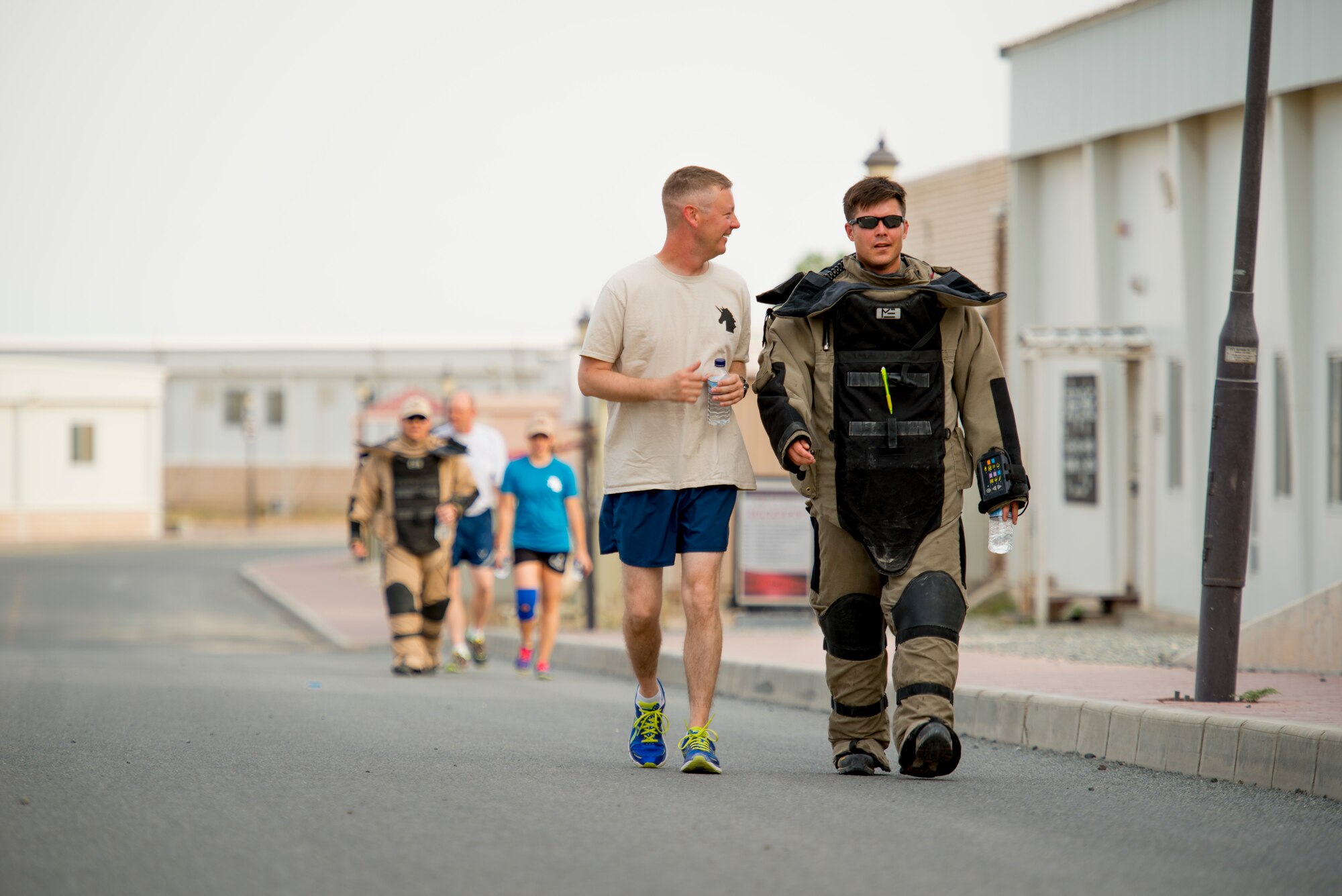 Military members of the 386th Air Expeditionary Wing show their support during a National Explosive Ordnance Disposal Day 5K run May 3, 2014 at an undisclosed location in Southwest Asia. The run memorialized EOD members from the different services who have paid the ultimate sacrifice in the defense of America. (U.S. Air Force photo by Staff Sgt. Jeremy Bowcock)