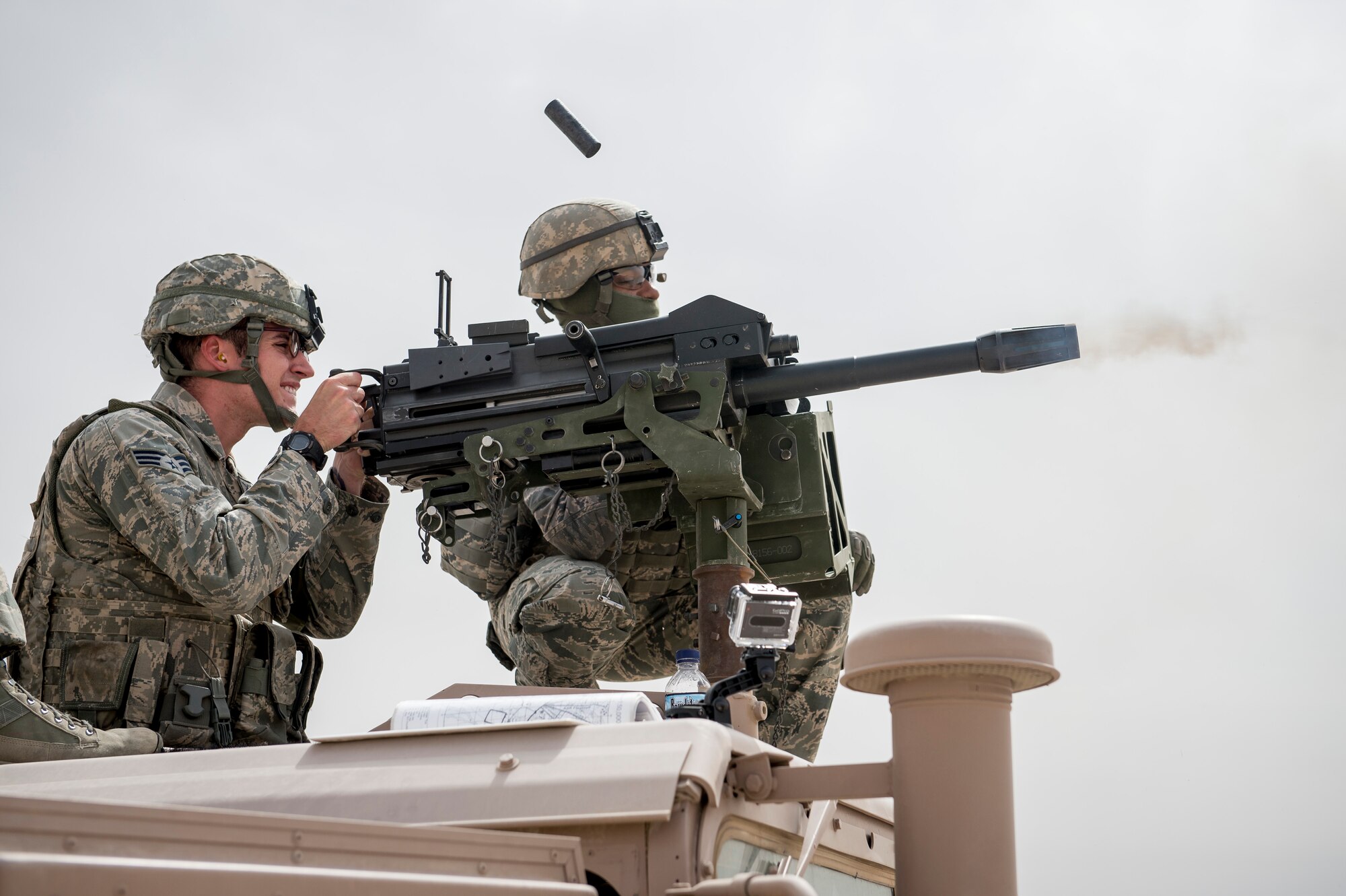 U.S. Air Force Staff Sgt. Jonathan Killebrew, 386th Expeditionary Security Forces Squadron, fires a Mark 19 40mm grenade machine gun on May 7, 2014 at an undisclosed location in Southwest Asia. Killebrew is deployed from the 99th Security Forces Squadron at Nellis Air Force Base, Nev. Qualified Security Forces members practice shooting about every two months to maintain proficiency with the weapons system. (U.S. Air Force photo by Staff Sgt. Jeremy Bowcock)