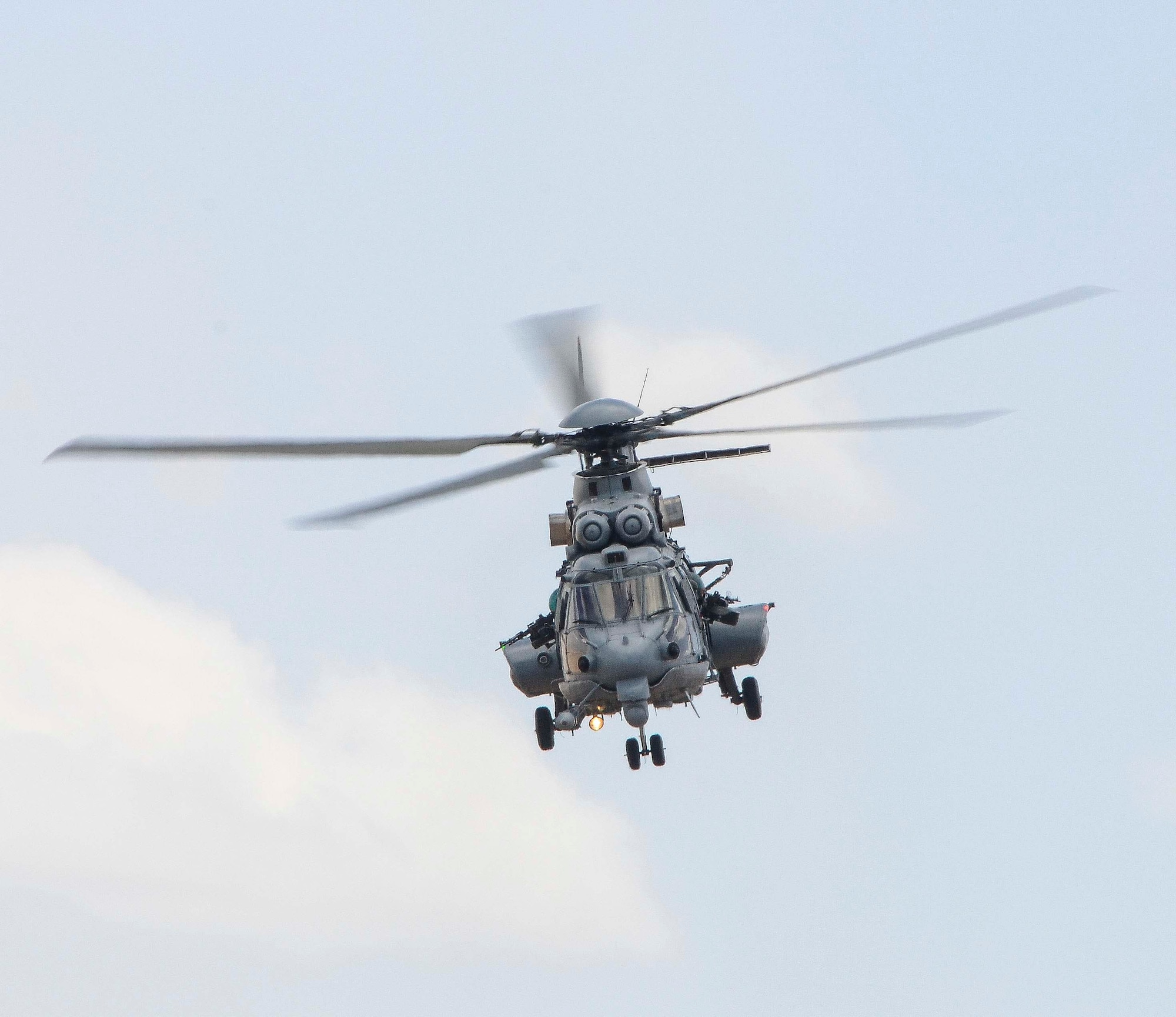 A French Eurocopter EC-735 Caracal flies during Exercise ANGEL THUNDER May 07, 2014 at Davis-Monthan Air Force Base, Ariz. ANGEL THUNDER 2014 is the largest and most realistic joint service, multinational, interagency combat search and rescue exercise designed to provide training for personnel recovery assets using a variety of scenarios to simulate deployment conditions and contingencies. Personnel recovery forces will train through the full spectrum of personnel recovery capabilities with ground recovery personnel, air assets, Special Forces teams and federal agents. (U.S. Air Force photo by Staff Sgt. Adam Grant/Released)