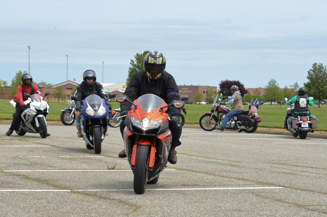 Motorcyclists ride during the Standing Together Against Rape Road Rally at Langley Air Force Base, Va., May 7, 2014. The Sexual Assault Prevention and Response team hosted the third annual road rally in recognition of Sexual Assault Awareness Month.  (U.S. Air Force photo by Airman 1st Class Devin Scott Michaels/Released)(This image was cropped to emphasize the subject; the levels were slightly adjusted for aesthetic purposes)
