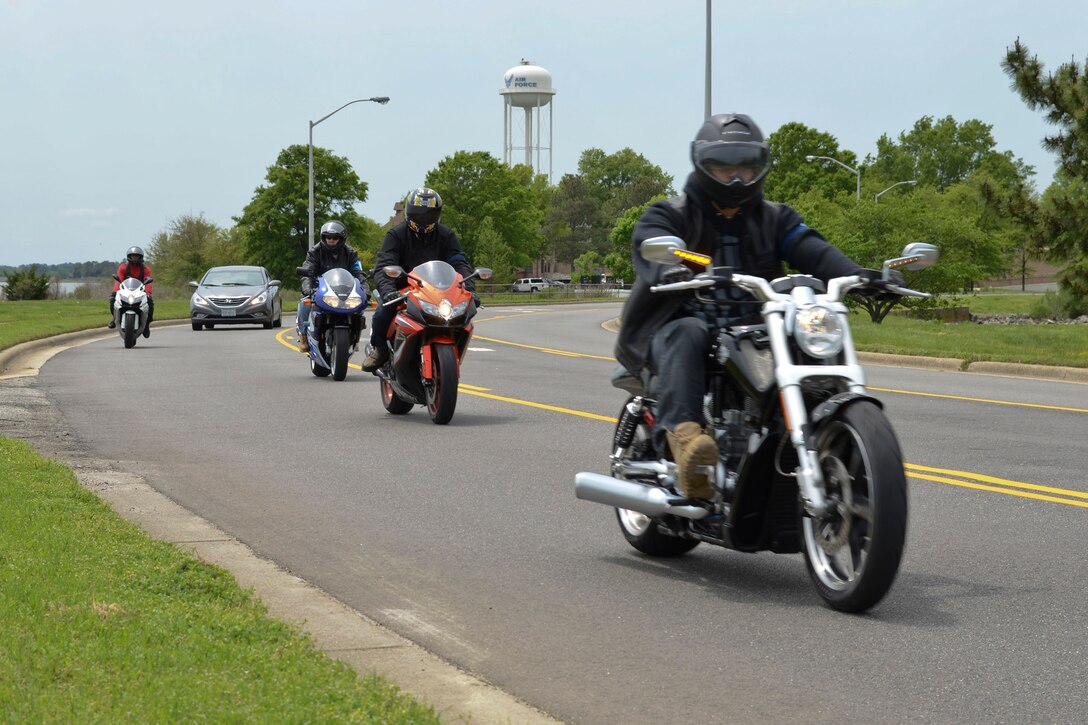 Motorcyclists return from a ride during the Standing Together Against Rape Road Rally at Langley Air Force Base, Va., May 7, 2014. The motorcyclists rode more than 70 miles, each wearing a teal Sexual Assault Awareness ribbon on their shoulder. "The road rally is a unique way to educate the public about sexual assault, advocate for its victims and try to eradicate future assaults," said C. Vanessa Williams, sexual assault response victim advocate. (U.S. Air Force photo by Airman 1st Class Devin Scott Michaels/Released)(This image was cropped to emphasize the subject; the levels were slightly adjusted for aesthetic purposes)
