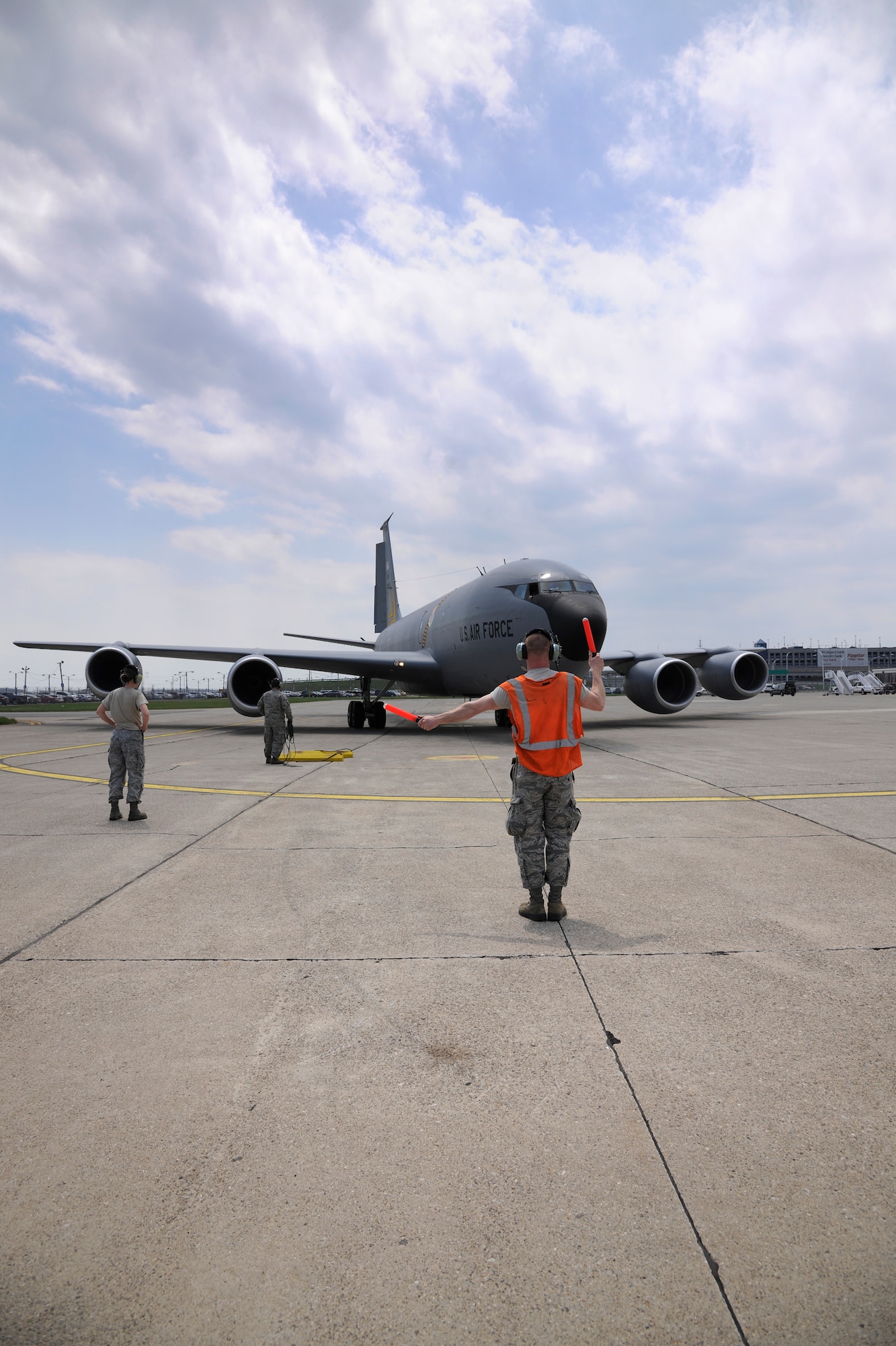 140509-Z-NQ307-036 - Airman 1st Class Logan Lyon marshalls in a KC-135 Stratotanker flown by the 171st Air Refueling Squadron from Selfridge Air National Guard Base, Mich., at Detroit Metro Airport on May 8, 2014. The crew and aircraft are returning from a month long deployment to CENTCOM. Some of the Michigan Air National Guard's KC-135s are operating out of Detroit Metro Airport during construction on the airfield at Selfridge. (U.S. Air National Guard photo by TSgt. Rachel Barton/Released)