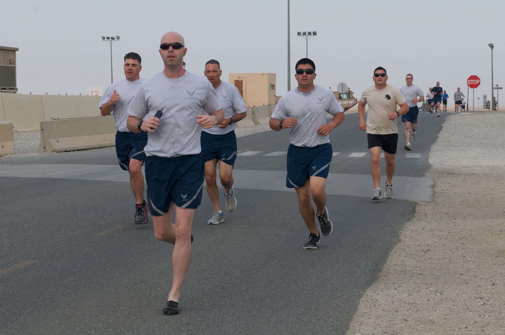 Runners from the 386th Air Expeditionary Wing joined more than 100 participants during a 5K run to celebrate National Explosive Ordnance Disposal Day May 3, 2014 at an undisclosed location in Southwest Asia. The run honored EOD technicians who have given their lives in defense of America’s freedom. (U.S. Air Force photo/Senior Master Sgt. Allison Day)