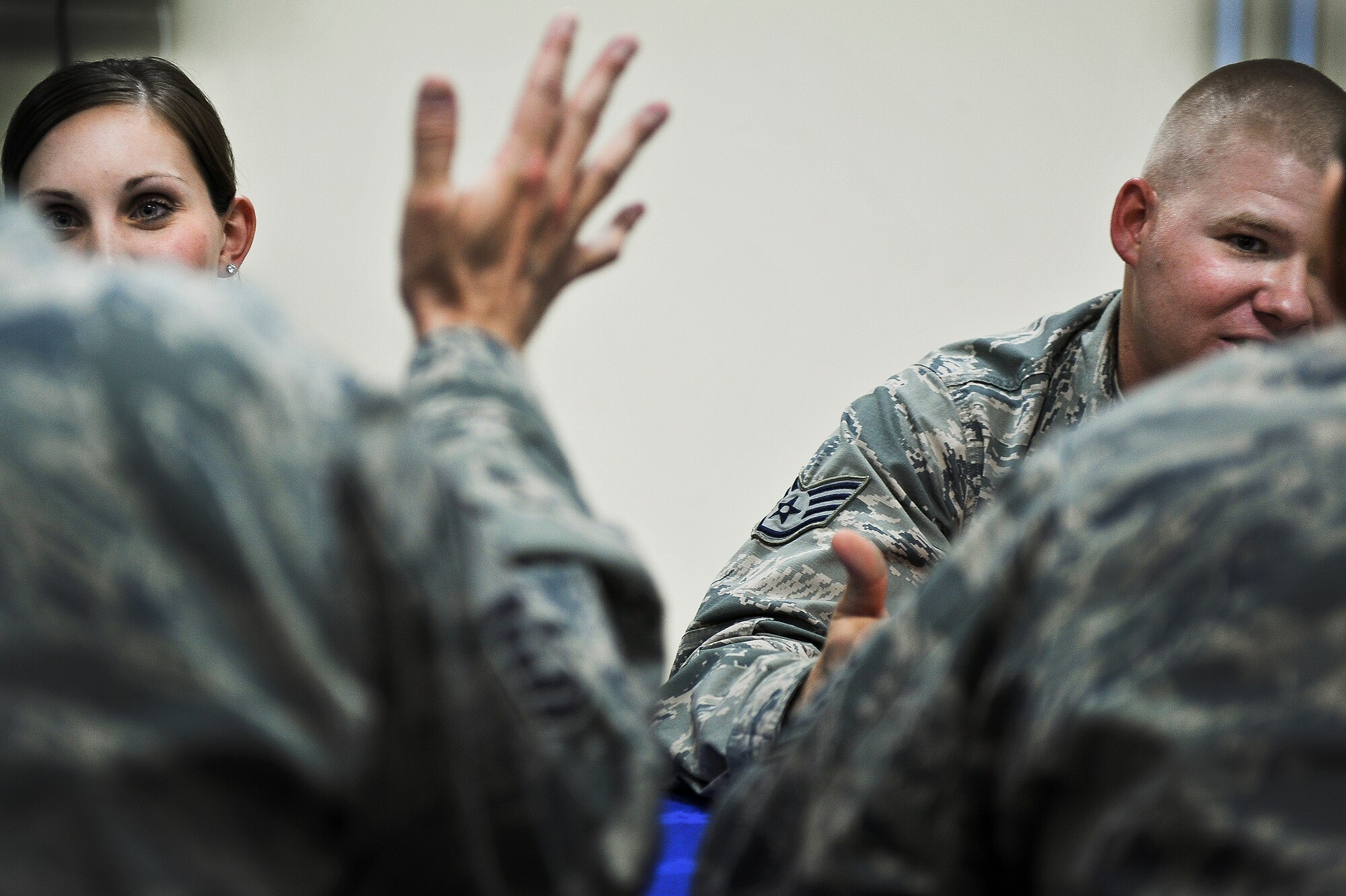 Senior Airman Gabrielle Crandall and Staff Sgt. Nolan Strange, 380th Expeditionary Civil Engineer Squadron, speak with Chief Master Sgt. John Elstrom, 380th Expeditionary Maintenance Squadron, and Senior Master Sgt. Mary McEwan, 380th Expeditionary Communications Squadron, during a speed mentorship event May 6, 2014, at an undisclosed location in Southwest Asia. The junior enlisted Airmen who took part conveyed a sense of deep satisfaction for the candid setting. (U.S. Air Force photo byTech. Sgt. Russ Scalf/Released)