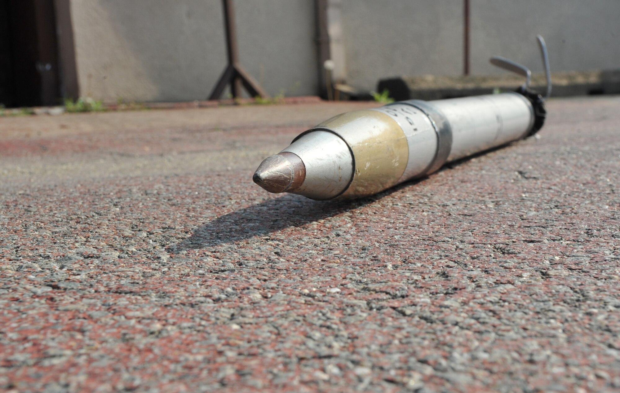 A mock unexploded ordnance is positioned near the 51st Logistics Readiness Squadron individual protective equipment building for a UXO scenario during Operational Readiness Exercise Beverly Bulldog 14-02 at Osan Air Base, ROK, May 8, 2014. Post-attack reconnaissance teams must conduct sweeps of their assigned area and call in UXO reports for explosive ordnance disposal teams to be dispatched. (U.S. Air Force photo/Airman 1st Class Ashley J. Thum)