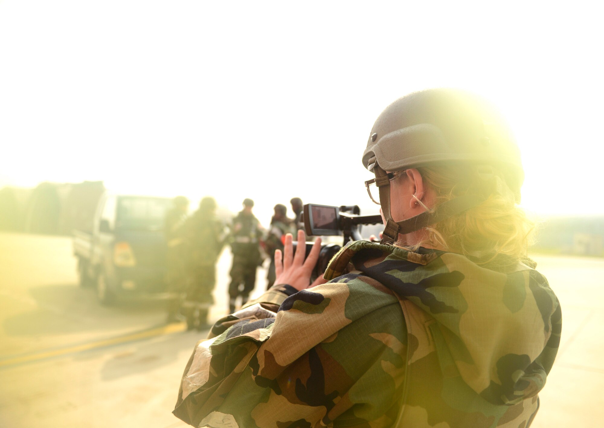 Senior Airman Lindy Pata, 51st Fighter Wing Public Affairs Office broadcaster, documents Operational Readiness Exercise Beverly Bulldog 14-02 at Osan Air Base, Republic of Korea, May 9, 2014. The exercises at Osan are held to prepare Airmen for real-world contingency operations in the ROK. (U.S. Air Force photo/Tech. Sgt. Micky M. Pena)