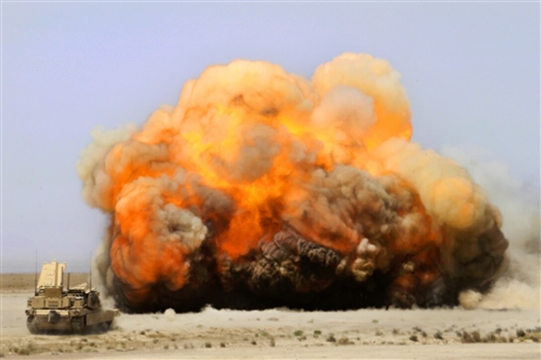 U.S. Marines use M1 assault vehicles to employ mine-clearing charges with rockets to detonate emplaced mines prematurely nearby Camp Leatherneck in Afghanistan's Helmand province, April 29, 2014. The Mariness are assigned to 1st Combat Engineers Battalion. 