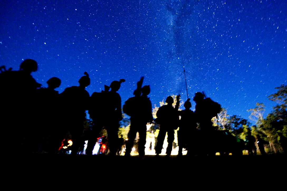 U.S. Marines prepare to collect simulated enemy casualties and weapons during a mechanized raid at Shoalwater Bay Training Area, Queensland, Australia, July 26, 2013. The Marines, assigned to the 31st Marine Expeditionary Unit, are participating in Talisman Saber 2013, a bilateral training exercise to enhance multilateral collaboration between U.S. and Australian forces for future combined operations, humanitarian assistance and natural disaster response.  
