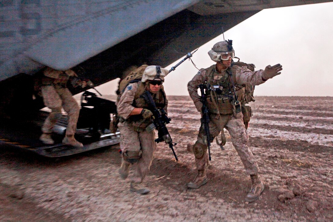 U.S. Marines exit a CH-53E Super Stallion helicopter during an operation in Tangi Sufla in Helmand province, Afghanistan, July 18, 2013.  
