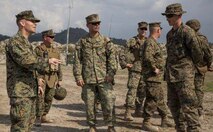 U.S. Marine Corps Col. Mark M. Walter, left, deputy commander, U.S. Marine Forces Balikatan 2014, discusses the setup of the ammunition supply point with U.S. Marine Corps Cpl. David S. Wright, right, the noncommissioned officer in charge for the ammunition supply point, May 3, 2014 in Crow Valley, Philippines. Walter visited the base camp where Balikatan 2014 will hold part of its field training exercise with the Armed Forces of the Philippines. Balikatan is an annual training exercise that strengthens the interoperability between the Armed Forces of the Philippines and U.S. military in their commitment to regional security and stability, humanitarian assistance and disaster relief. Wright is assigned to 3rd Maintenance Battalion, Combat Logistics Regiment 35, 3rd Marine Logistics Group, III Marine Expeditionary Force. (U.S. Marine Corps photo by Lance Cpl. Joey S. Holeman, Jr./Released)
