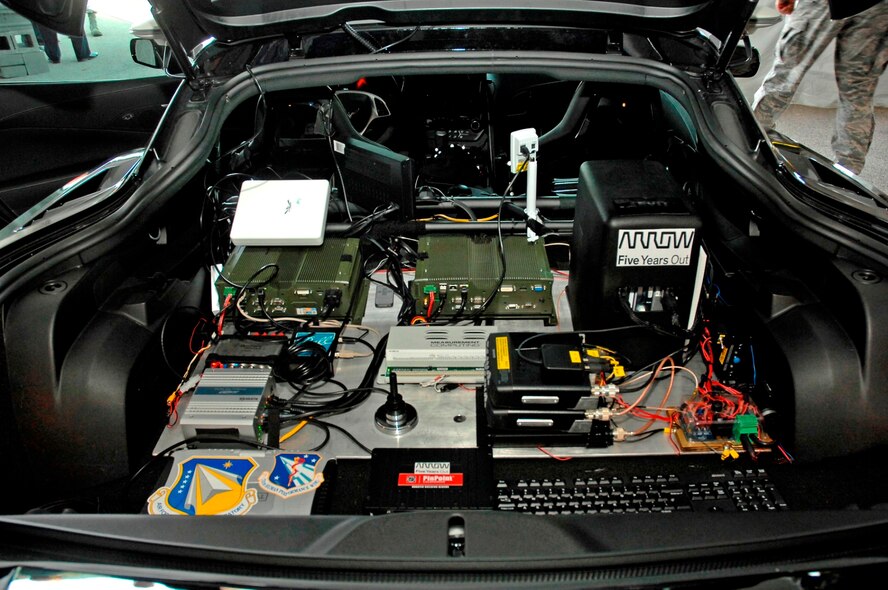 In the rear area of the Semi-Autonomous Motorcar (SAM), which is a 2014 Corvette C7 Stingray car, is equipment that controls the car according to Sam Schmidt physical input by head motion or stopping via a bit pressure sensor. (USAF photo by Al Bright