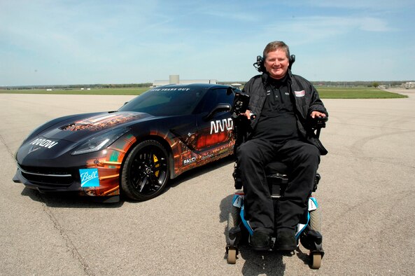 Sam Schmidt, former Indy Racing League driver, is stationed in front of a Semi-Autonomous Motorcar know as SAM which he drove 84 mpr on the runway next to the National Museum of the United States Air Force during a demonstration to showcase new human performance technologies on May 6. (USAF photo by Al Bright)